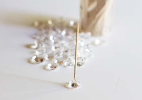 Now stick your toothpick to your diamond and try to make it as a straight as possible.