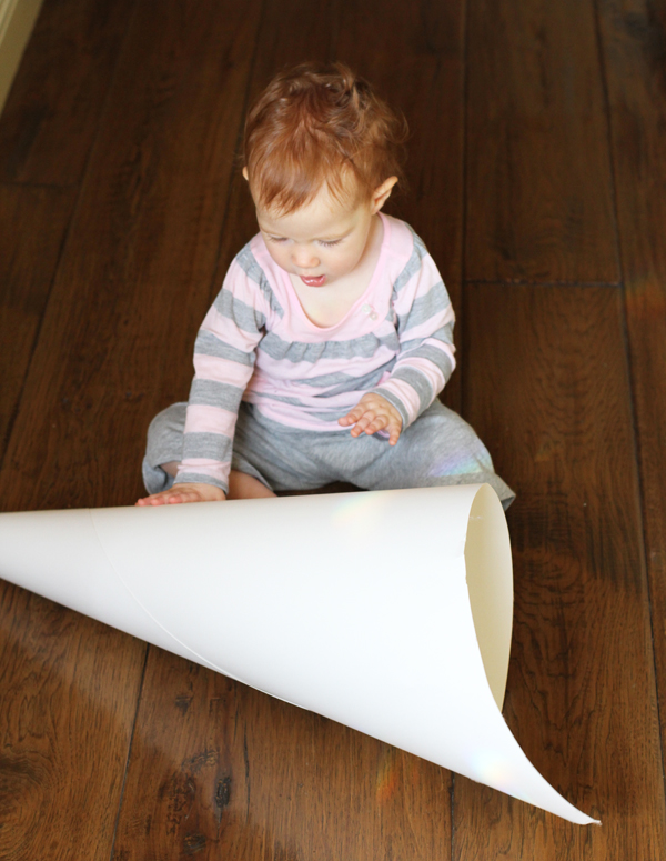 To start you will need 12pt poster board. I made a pretty big piñata so my poster board was 32" wide. A smaller board would have been easier. Roll your board into a cone and tape it in place.