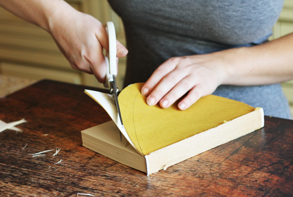 Now start cutting the rest of the pages along your half circle. You can cut multiple pages at one time so it speeds up the process.
