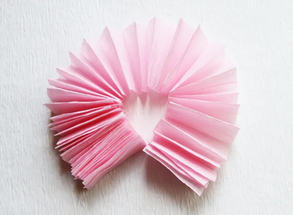 Bring the pinwheel around till the ends meet. You are going to glue the ends together.