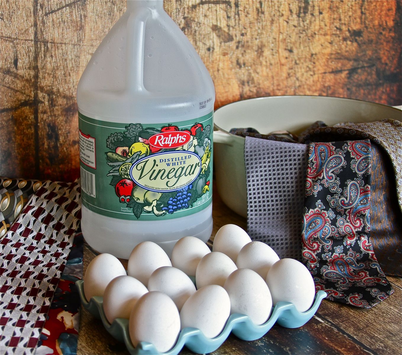 You will need white vinegar, one dozen raw eggs (you can also use blown-out eggs), a bunch of old silk ties, and an enamel pot. 