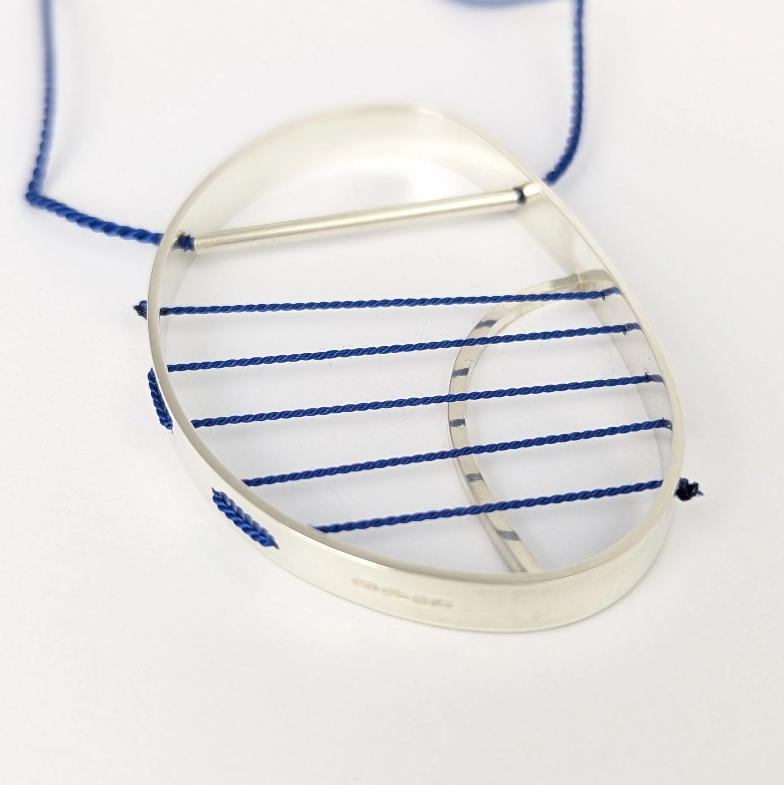 Hepworth necklace blue on blue.jpg