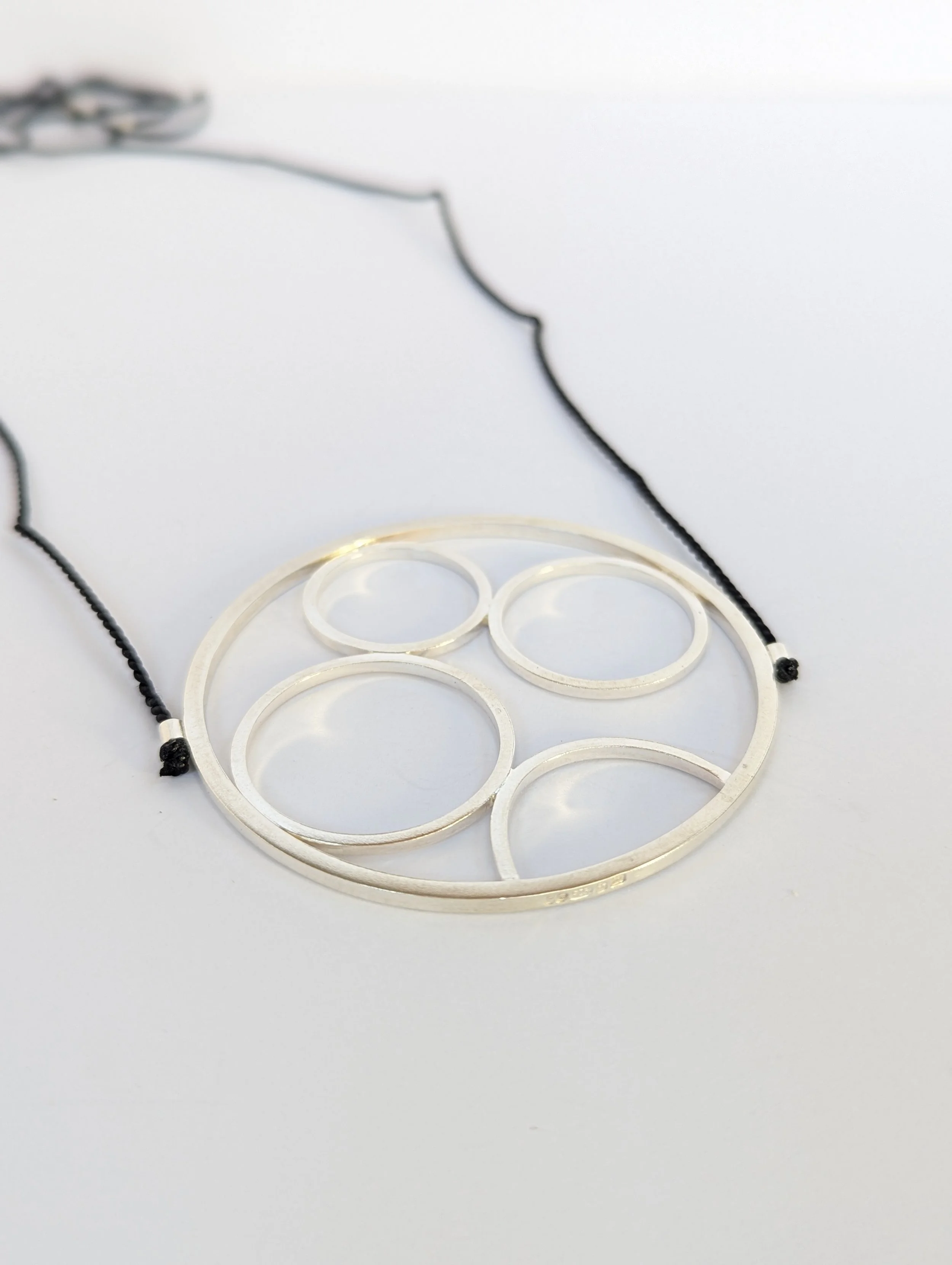 encircled necklace on black.jpg