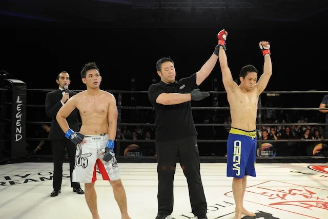Diego winner arm raised at Legend 9 MMA