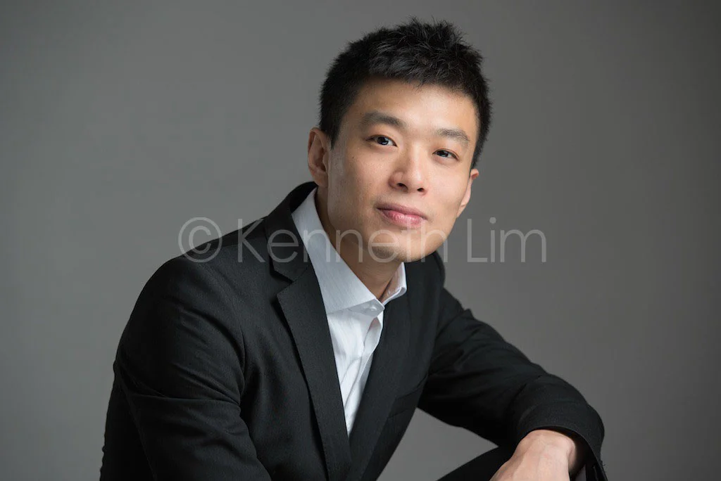 corporate headshot hong kong executive professional banker portrait in studio dark background