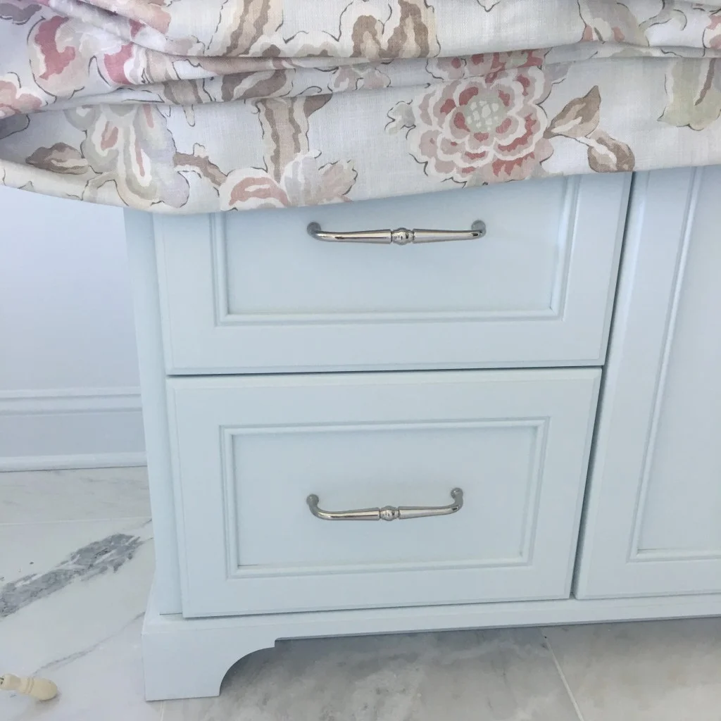 Pale Mint Green cabinetry featured in a master bath renovation. Design by Traci Zeller Designs .