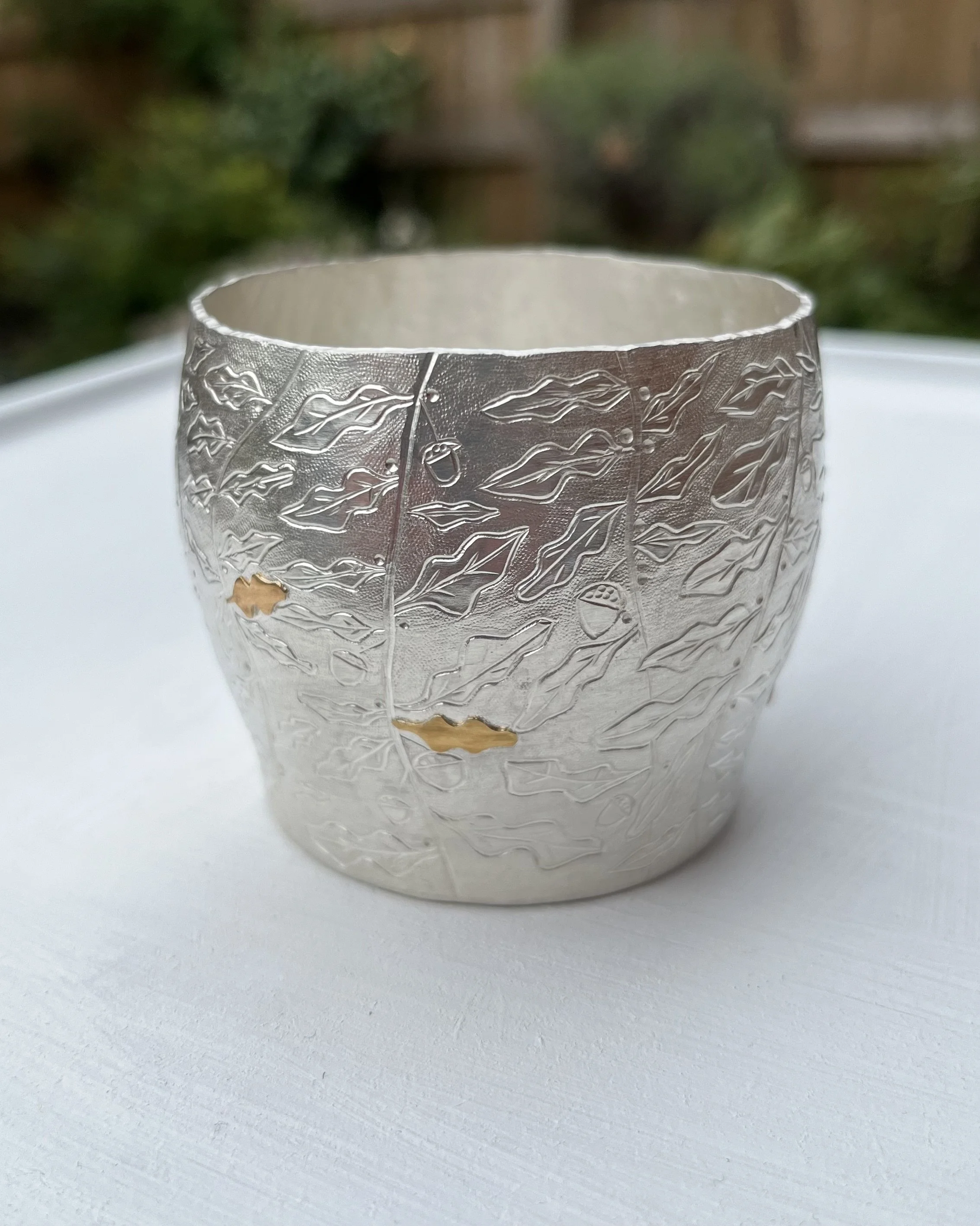 Hand raised and chased Whiskey cup