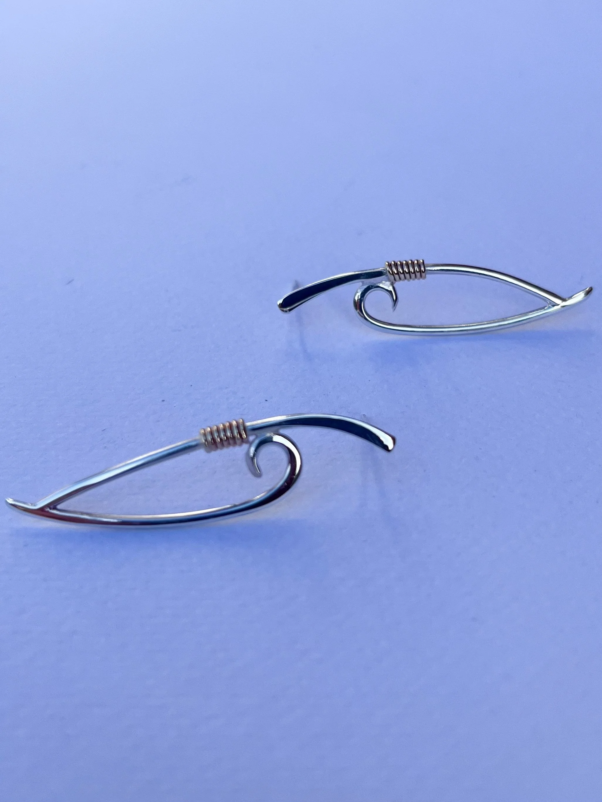 Silver Stud earrings with gold wire.