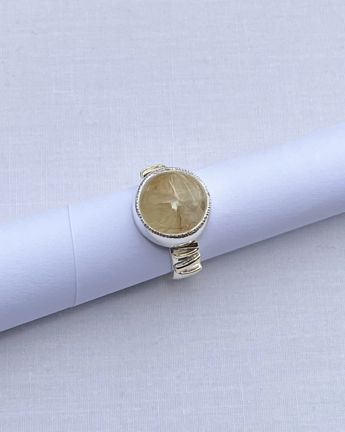 Rutile Quartz with gold detail.