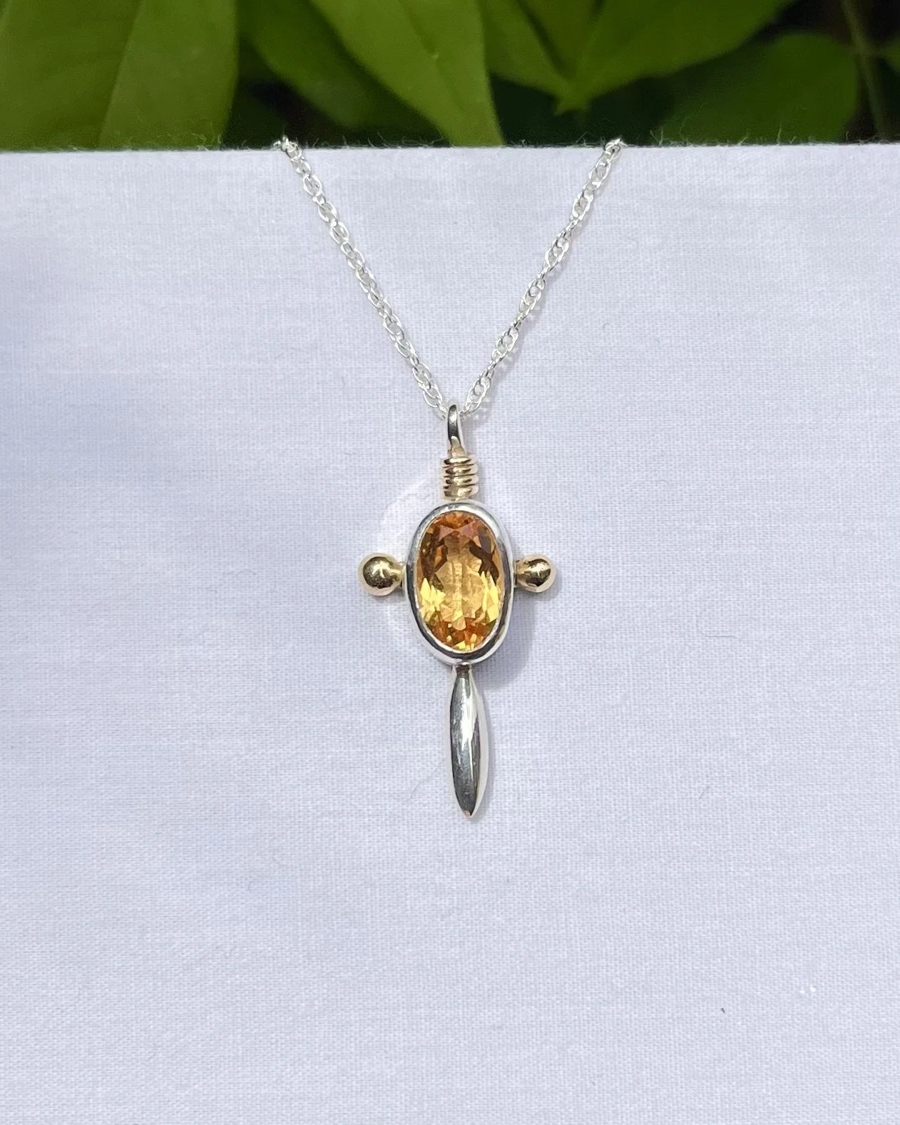 Citrine necklace with gold detail. 