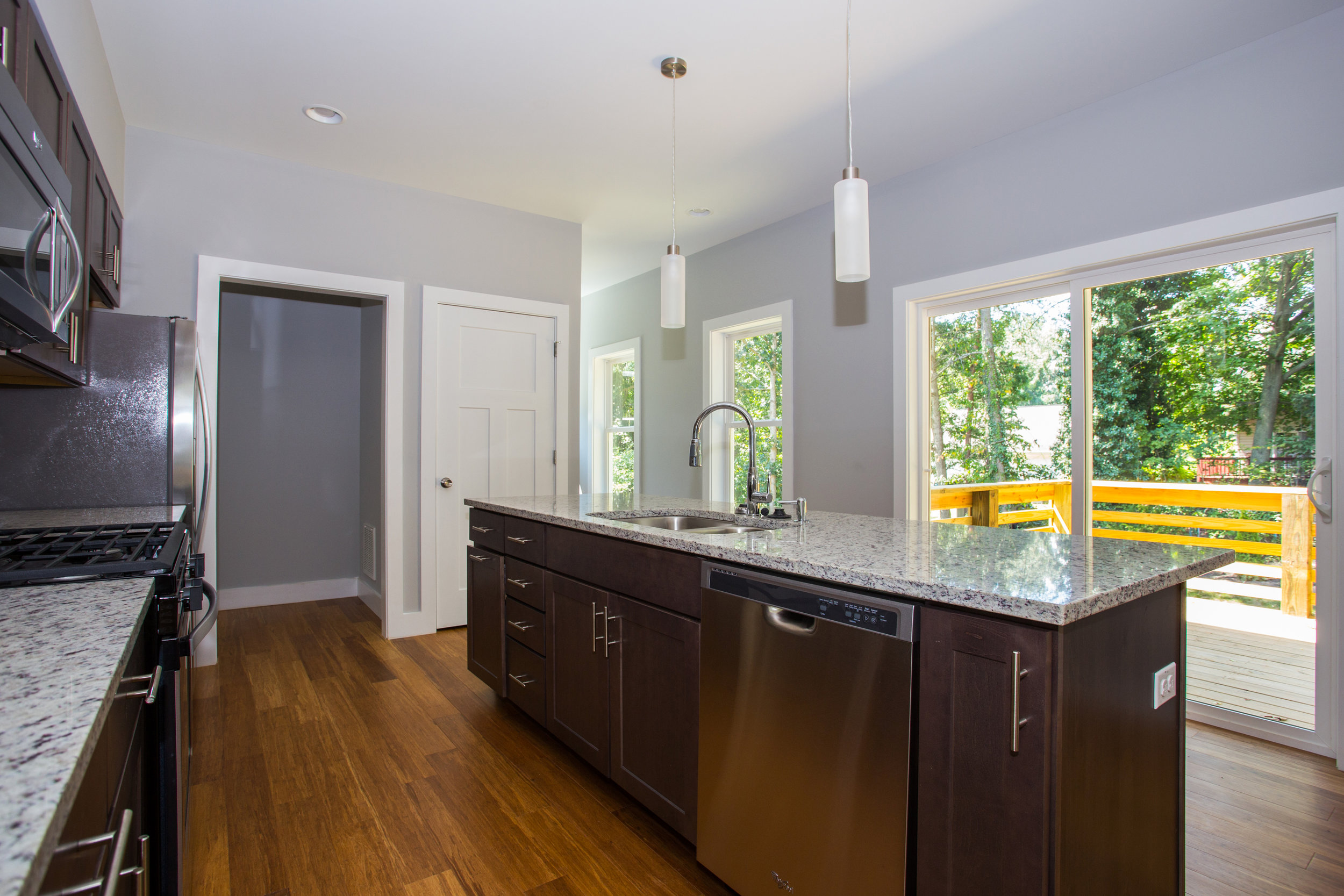  Kitchen/dining room opens to back spacious patio and private enclosure 