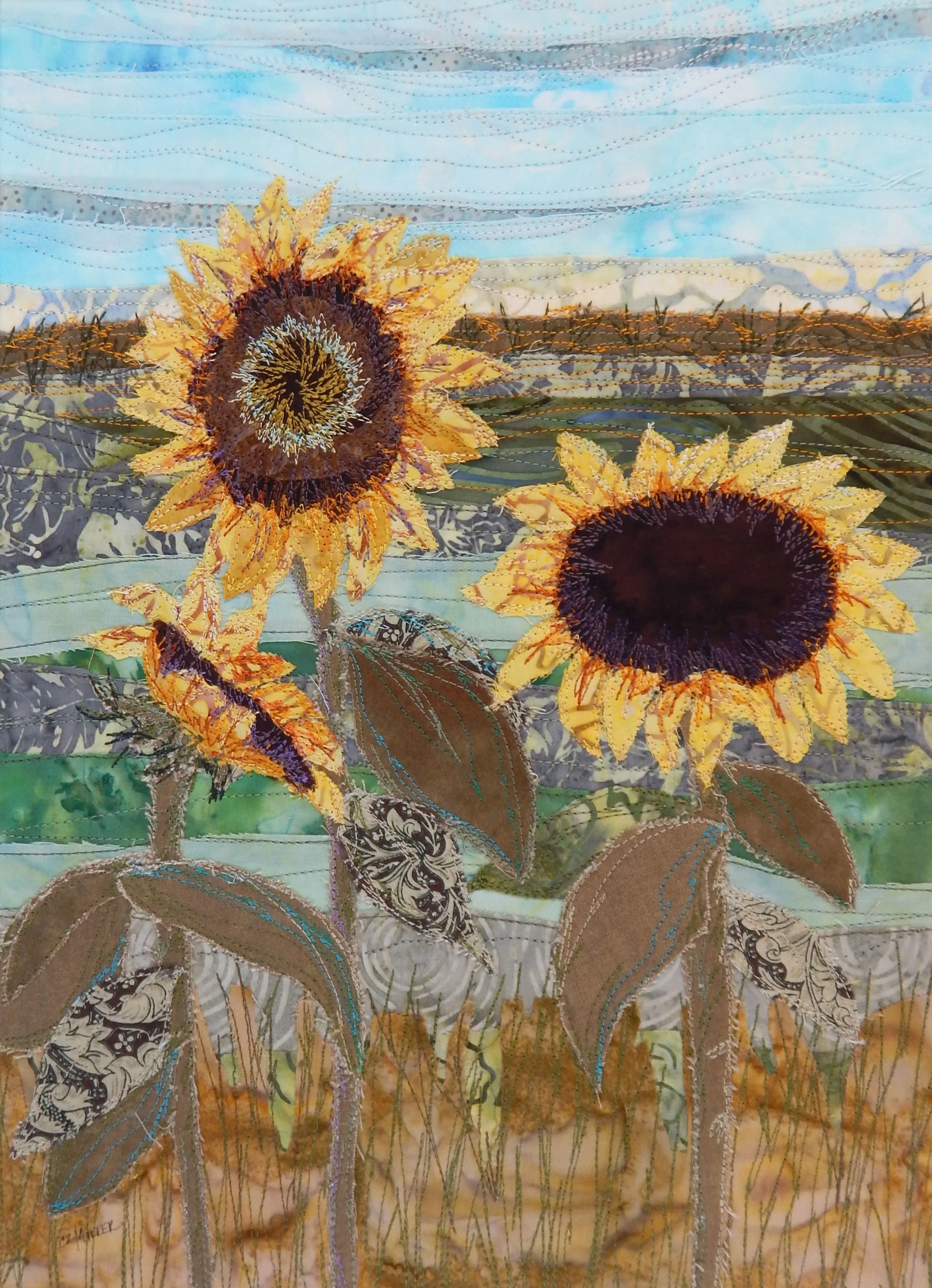 Sunny Days - framed fabric collage made with hand dyed cottons, batiks and printed fabrics, machine stitched/raw edge appliquéd