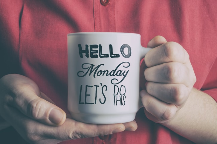 Holding a mug of coffee.jpg