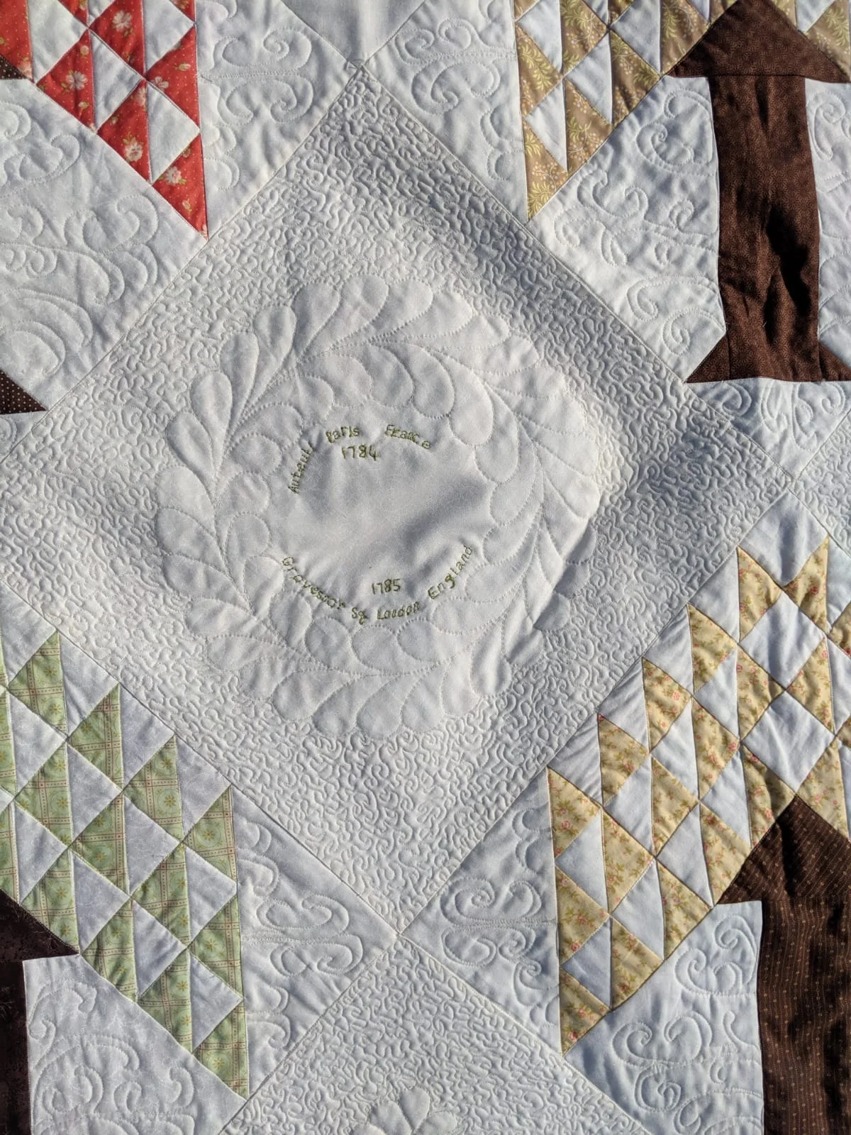 Hand quilted feathers.jpg