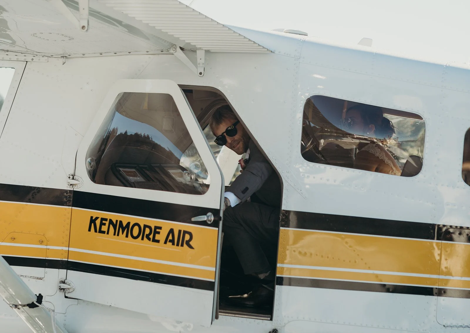 A couple is about to deboard a Kenmore Air seaplane to walk to their ceremony