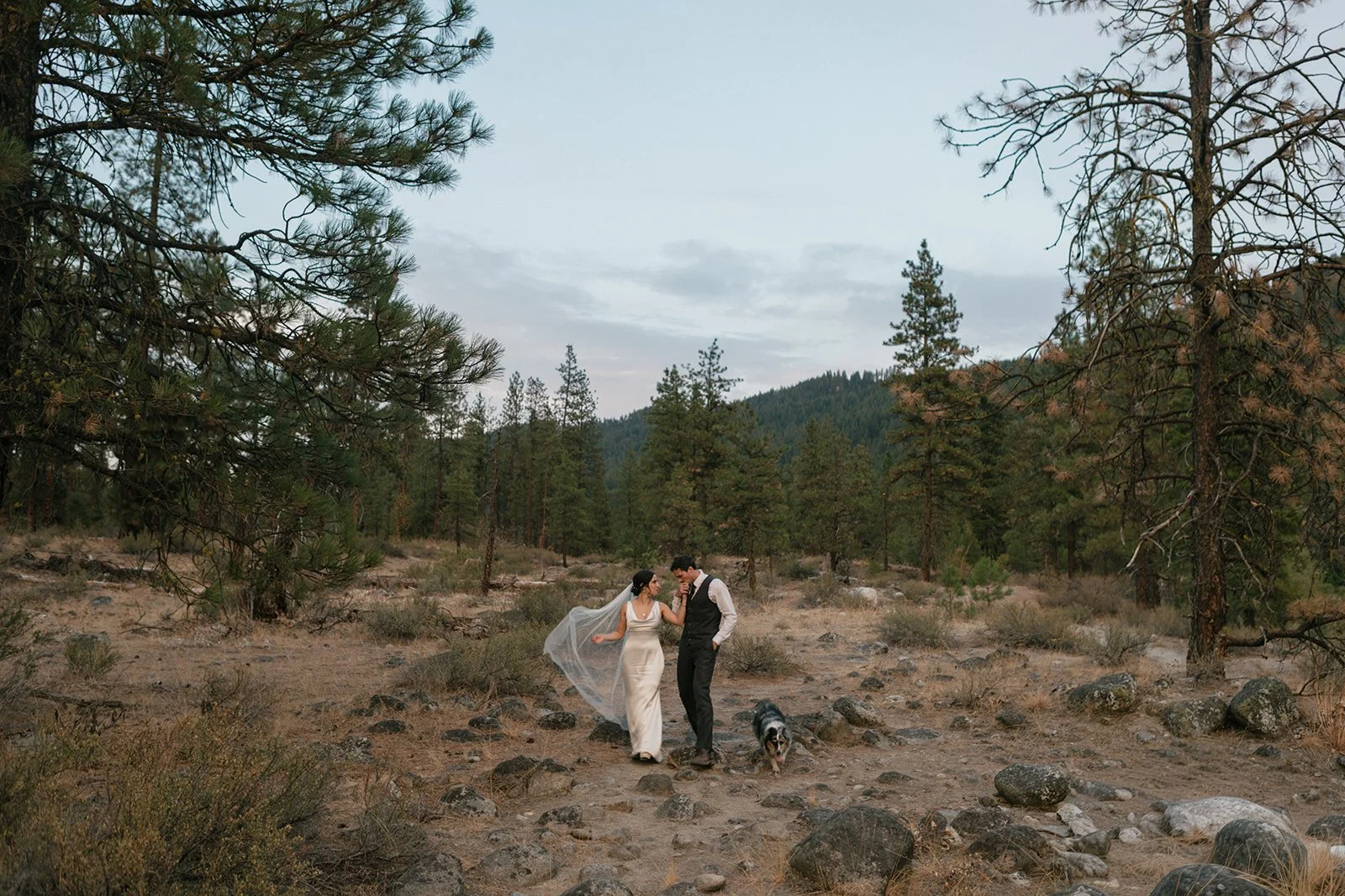 The couple walk the grounds of Sleeping Lady Mountain Resort in Leavenworth as he kisses her hand.