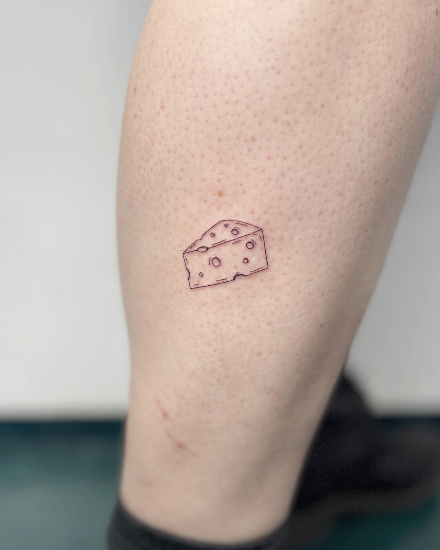 #cheeseplease 🧀
A piece of cheese for Mr Mouse. Loved it!
Thanks for your trust 🖤

⫸ 
Booking info: If you want to get inked, please stay patient. My books are closed. New dates will be announced in the beginning of June 🫶🏻 #nodms 

#cheesetattoo