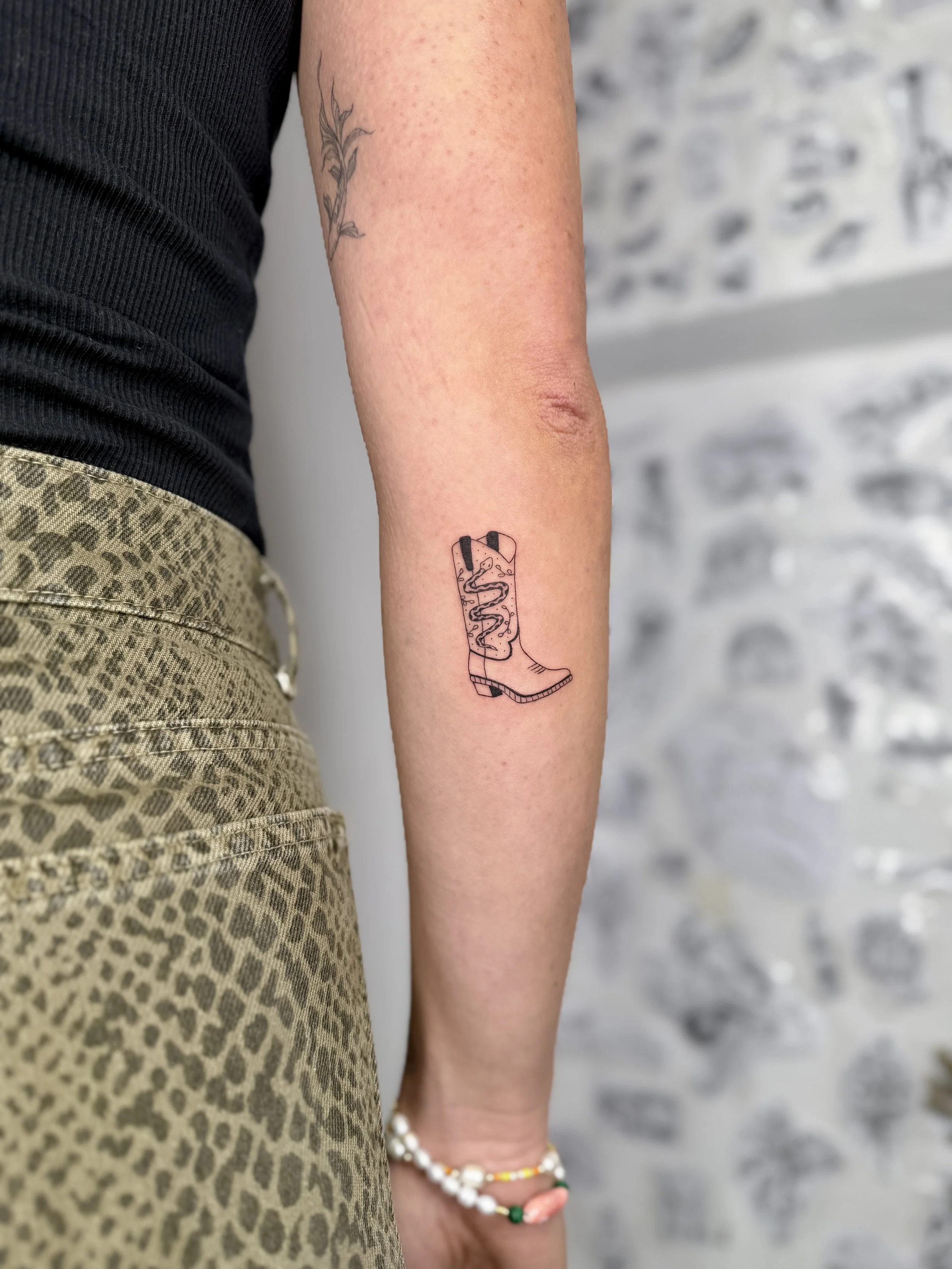 FrauInes_Tattoo_Cowboystiefel.jpg