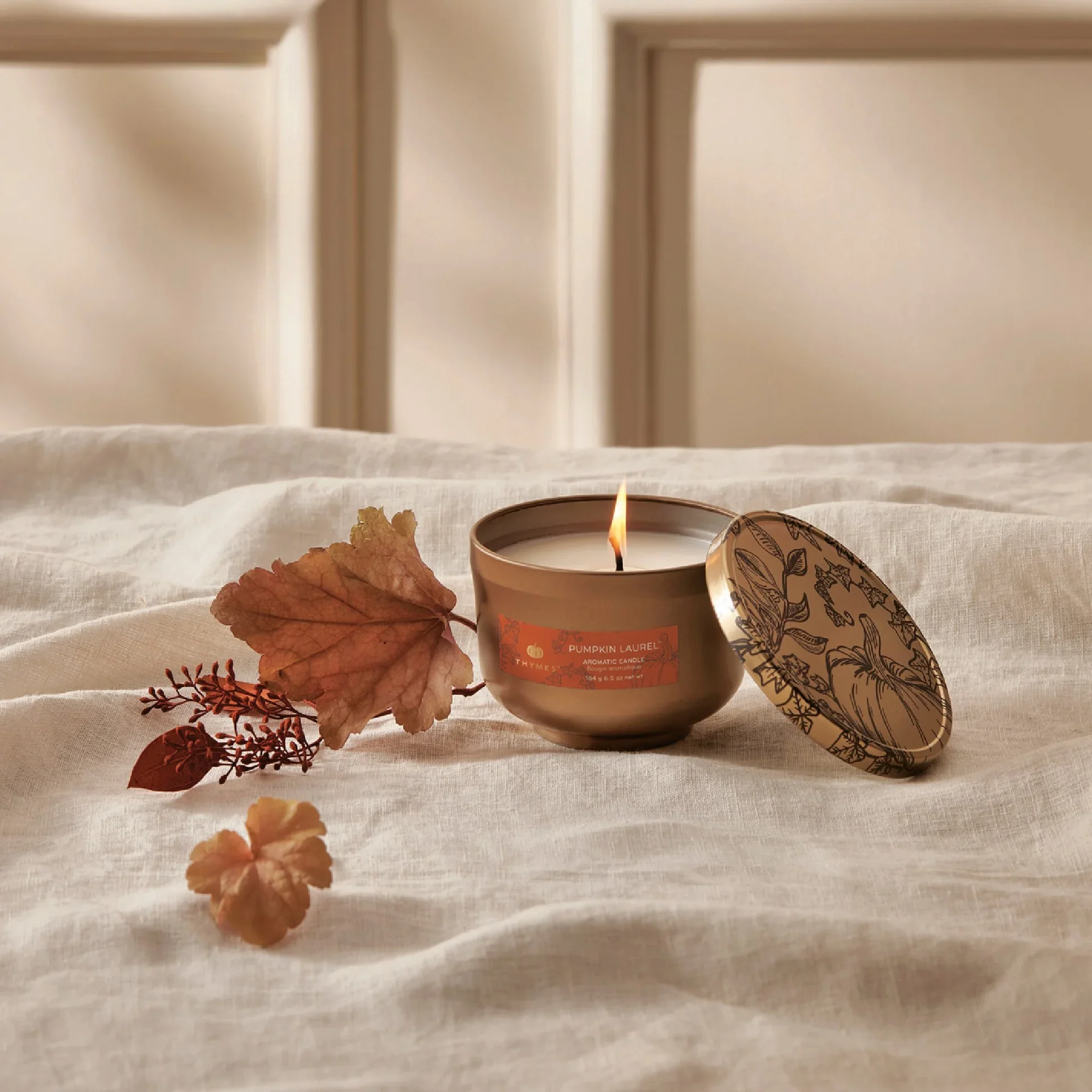 thymes-hy23-pumpkin-laurel-candle-tin-web-alt-1.jpg.webp