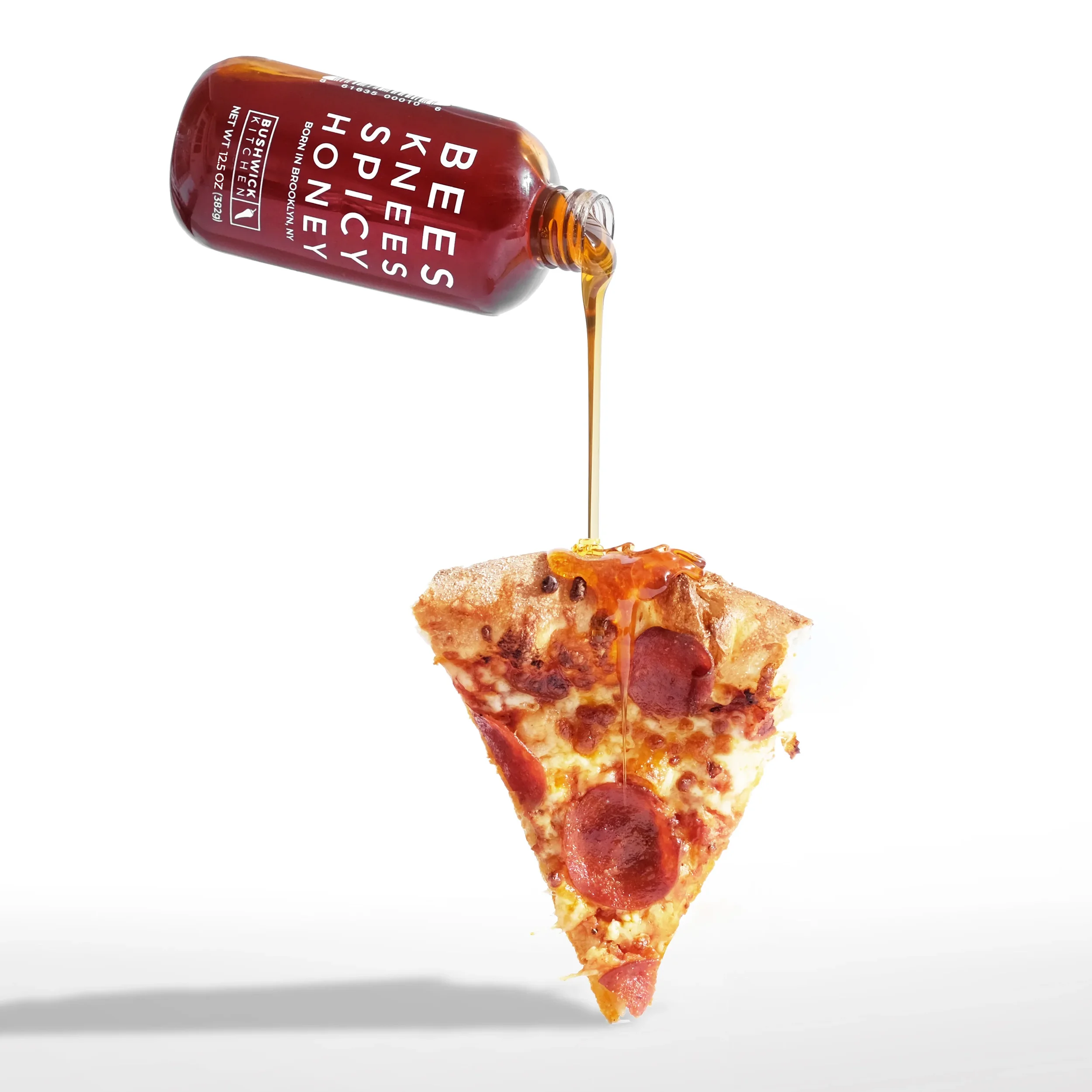 SpicyHoneyFloatingPizzaPour_8f7a9a1f-4964-4e47-92d7-b3c5cec39576.jpg.webp