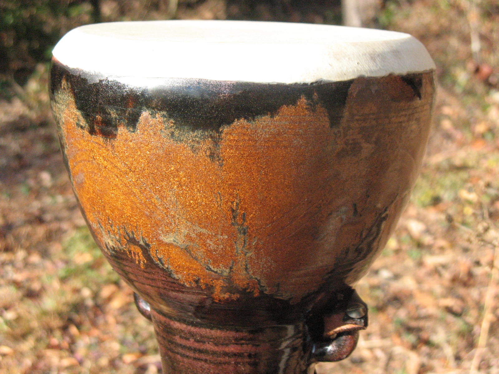  This drum was fired in a gas kiln.&nbsp; Tenmoku glaze with an iron based wash. 