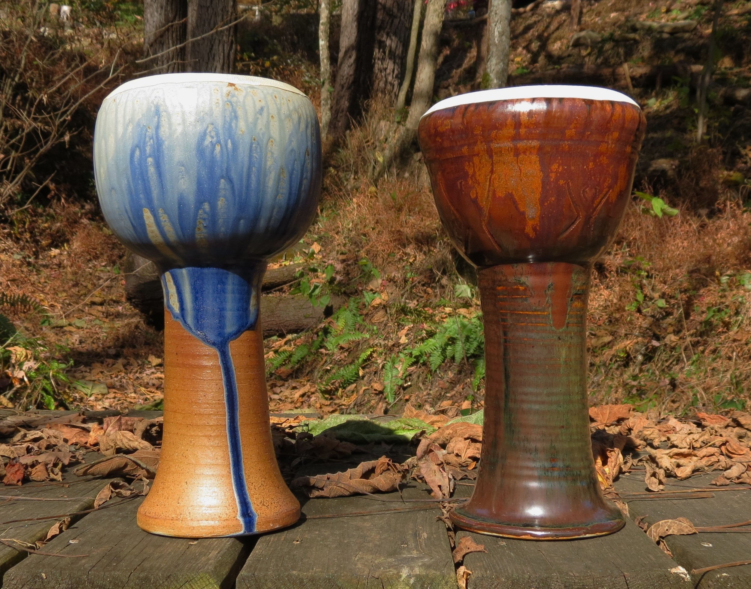  Wood fired doumbeks.&nbsp; The one on the right is a cobalt ash glaze and the left is tenmoku with an iron based wash.&nbsp; The heads are goatskin and are glued to the ceramic body. 