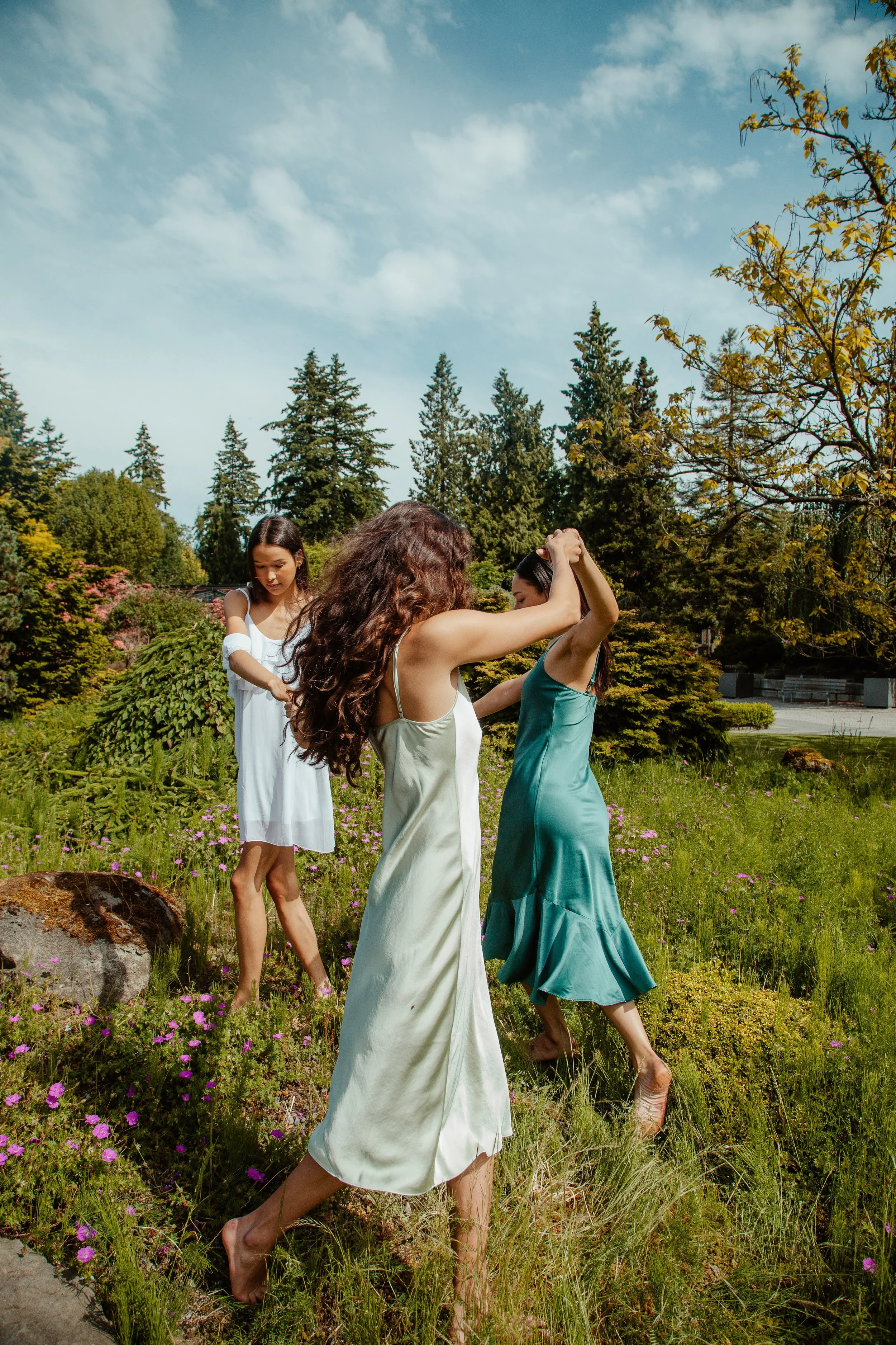 three models in a lifestyle editorial garden
