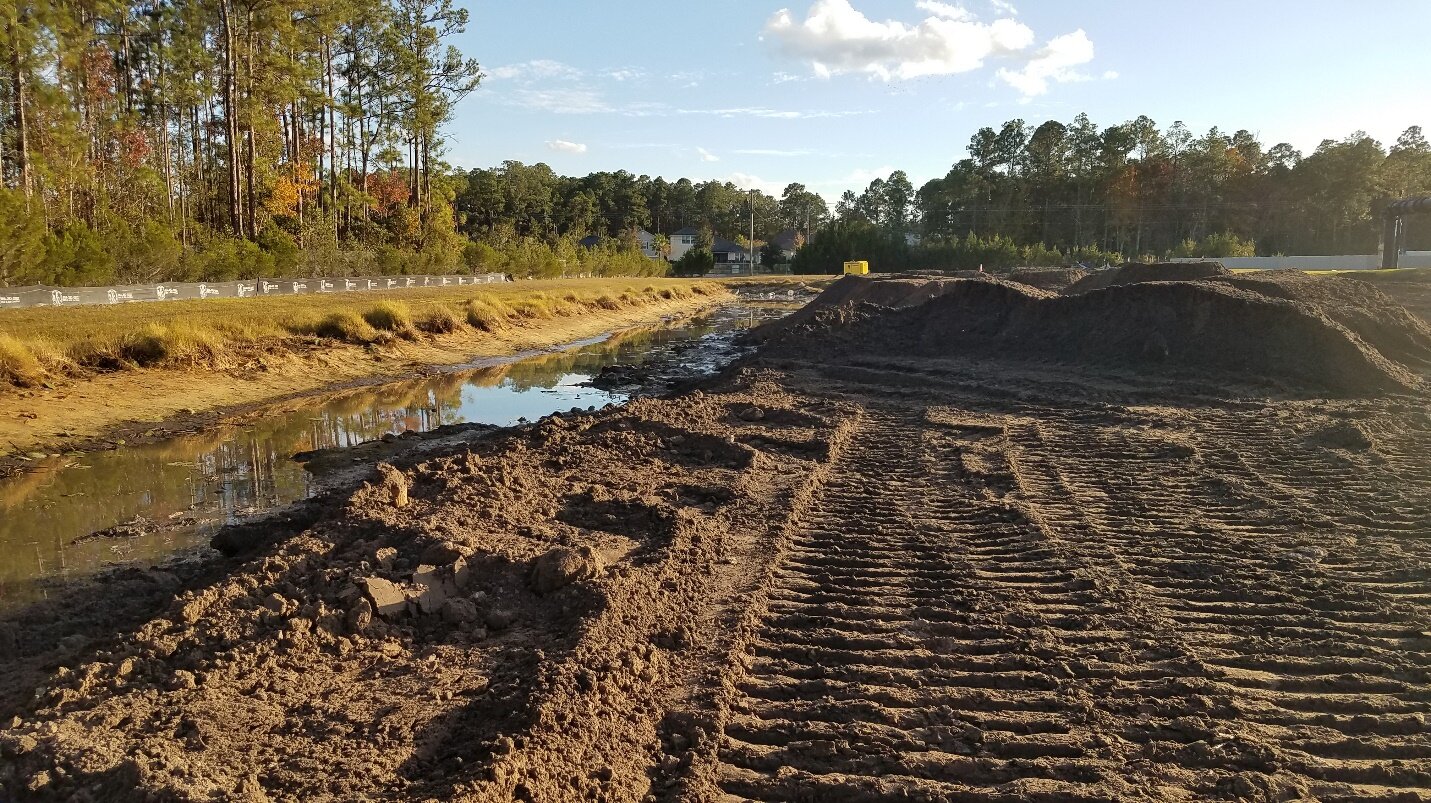 Filling stormwater pond to create a foundation for the PES bed. (12/09/2019)