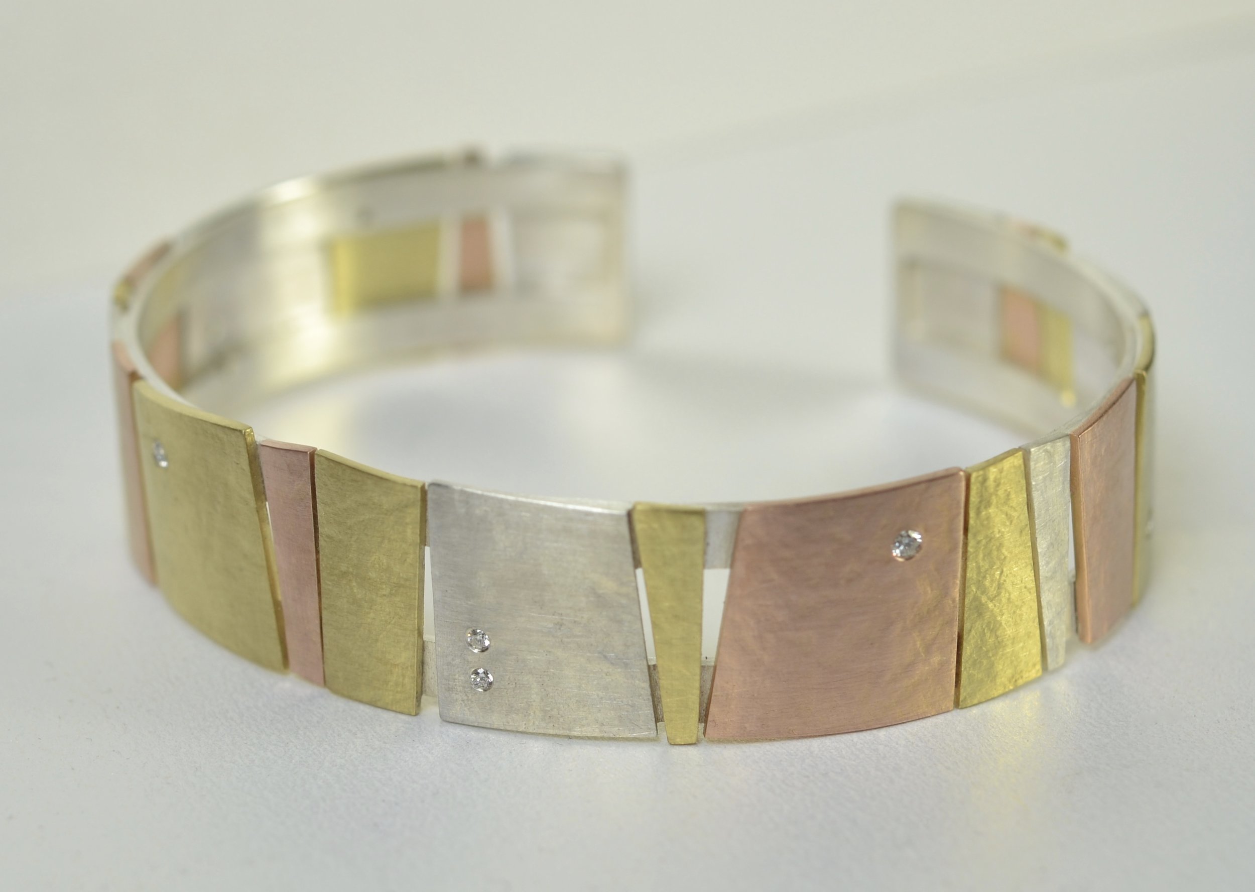  cuff, multi colored gold, silver, diamond 