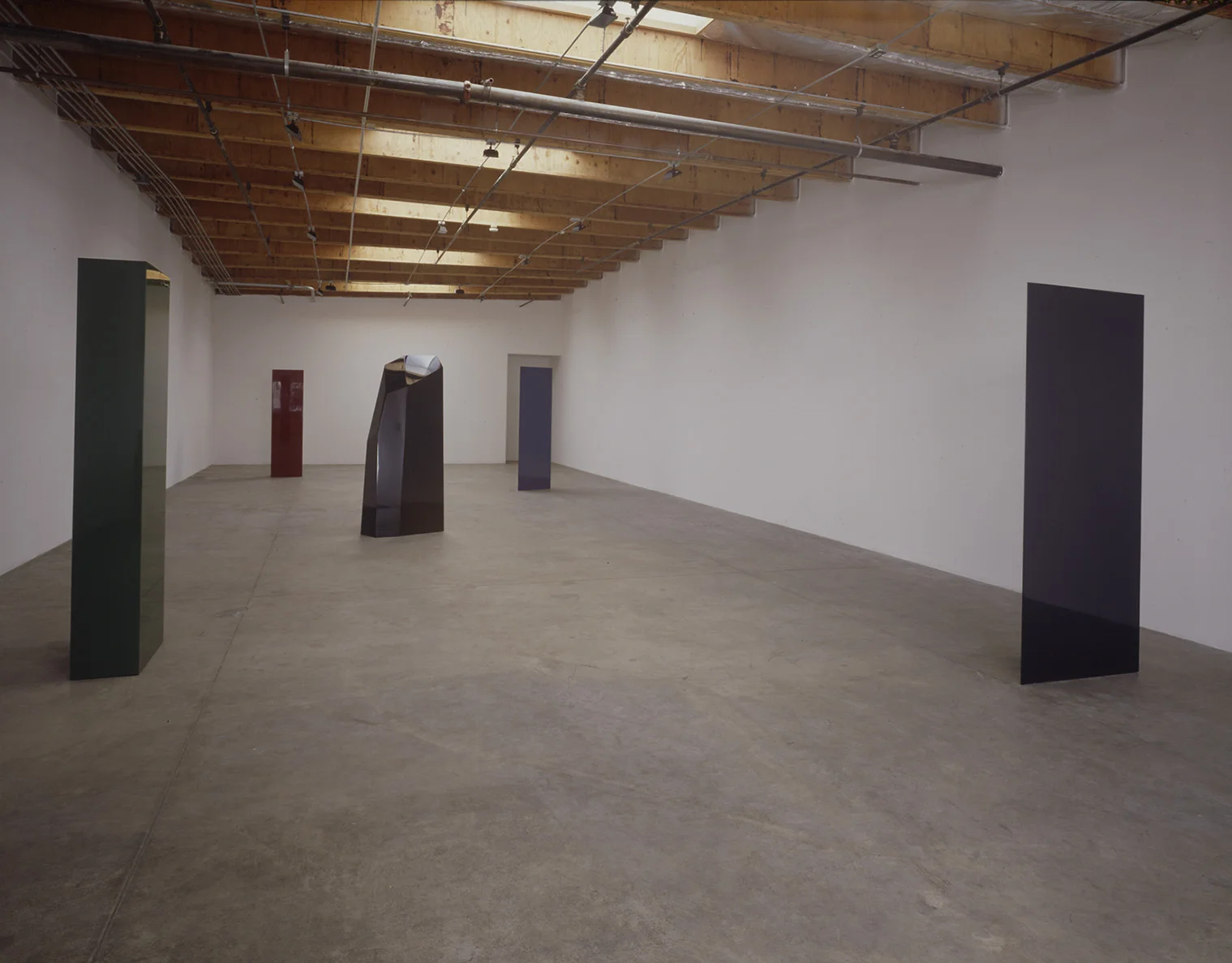 John McCracken Installation Hoffman Borman Gallery 1988.jpg