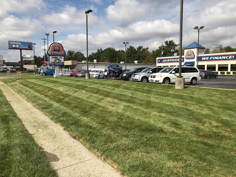 Crosshatch mowed front lawn, complete lawn maintenance offered from Ivanoff.
