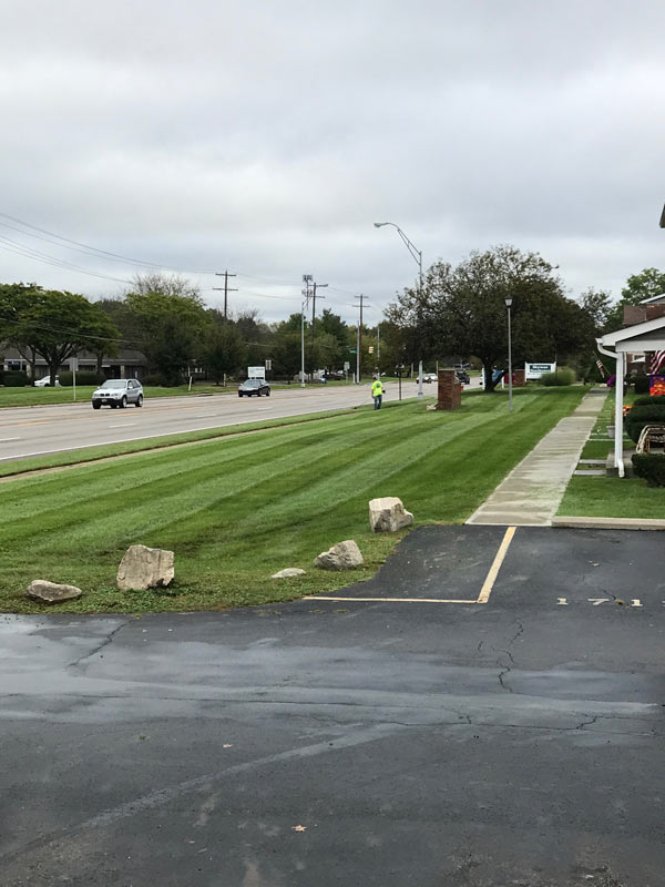 Fresh mowed grass by parking lot, Columbus landscaping company Ivanoff to thank!