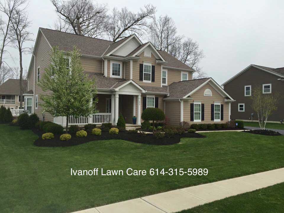 Well kept front lawn of home by Columbus landscape company.