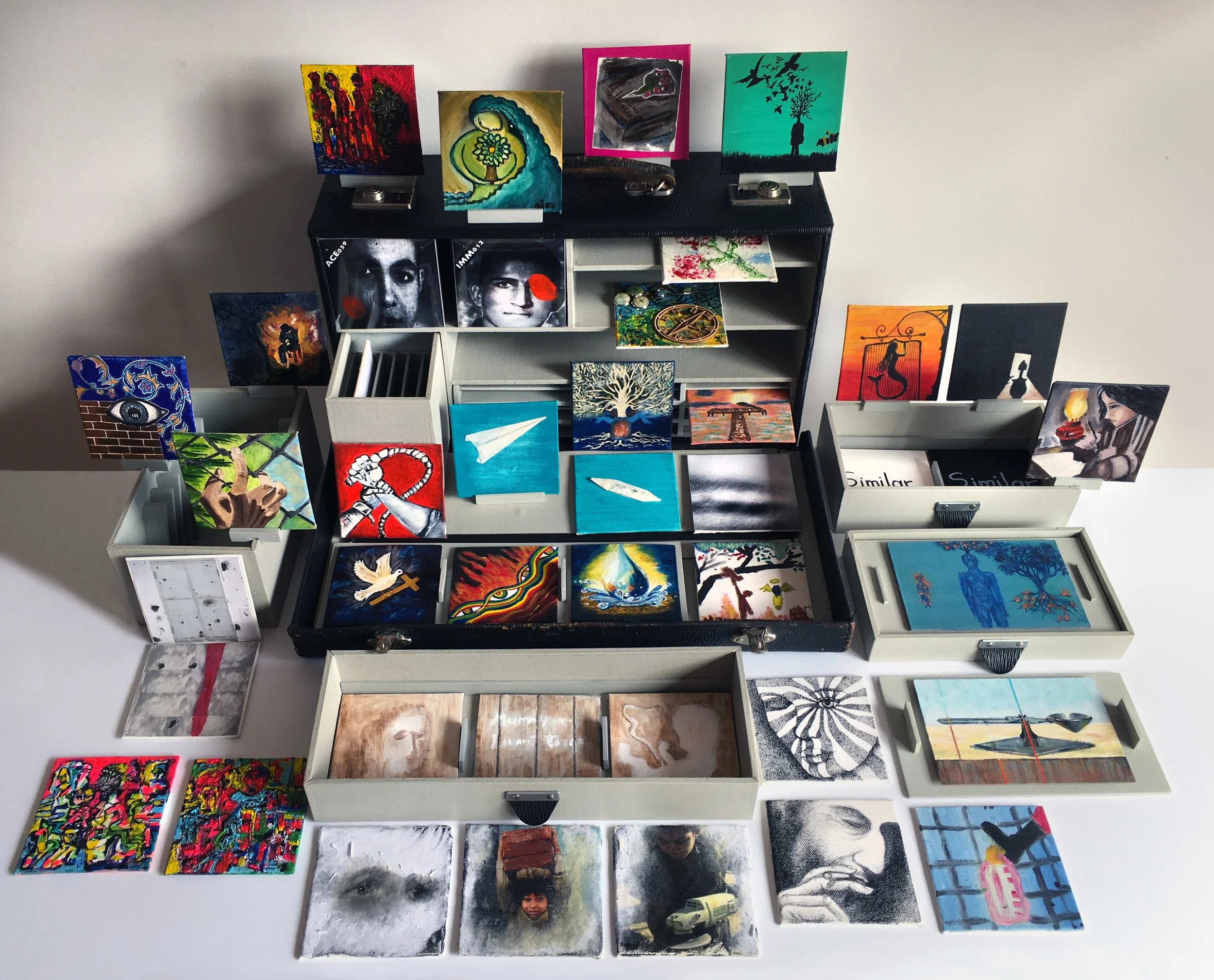 Attaché Case. Artists include: Mitra Ashanti, Neda Daryabar, Alyana Eau, BHR, Sririhan Ganeshan, Dagmara Gieysztor, Tadros Hanna, Zohreh Izadikia, Mehdi Jaghuri, Carmenza Jimenez Osorio, Azizeh Khademi, Samaneh Malekshahi, Gyorgyi Marek, Margaret Mayhew, Noony, Minh Phan, Anthony Rodriguez, Eghbal Saki, Rayka,.Maryam Sepasi, Honey & Azizeh.