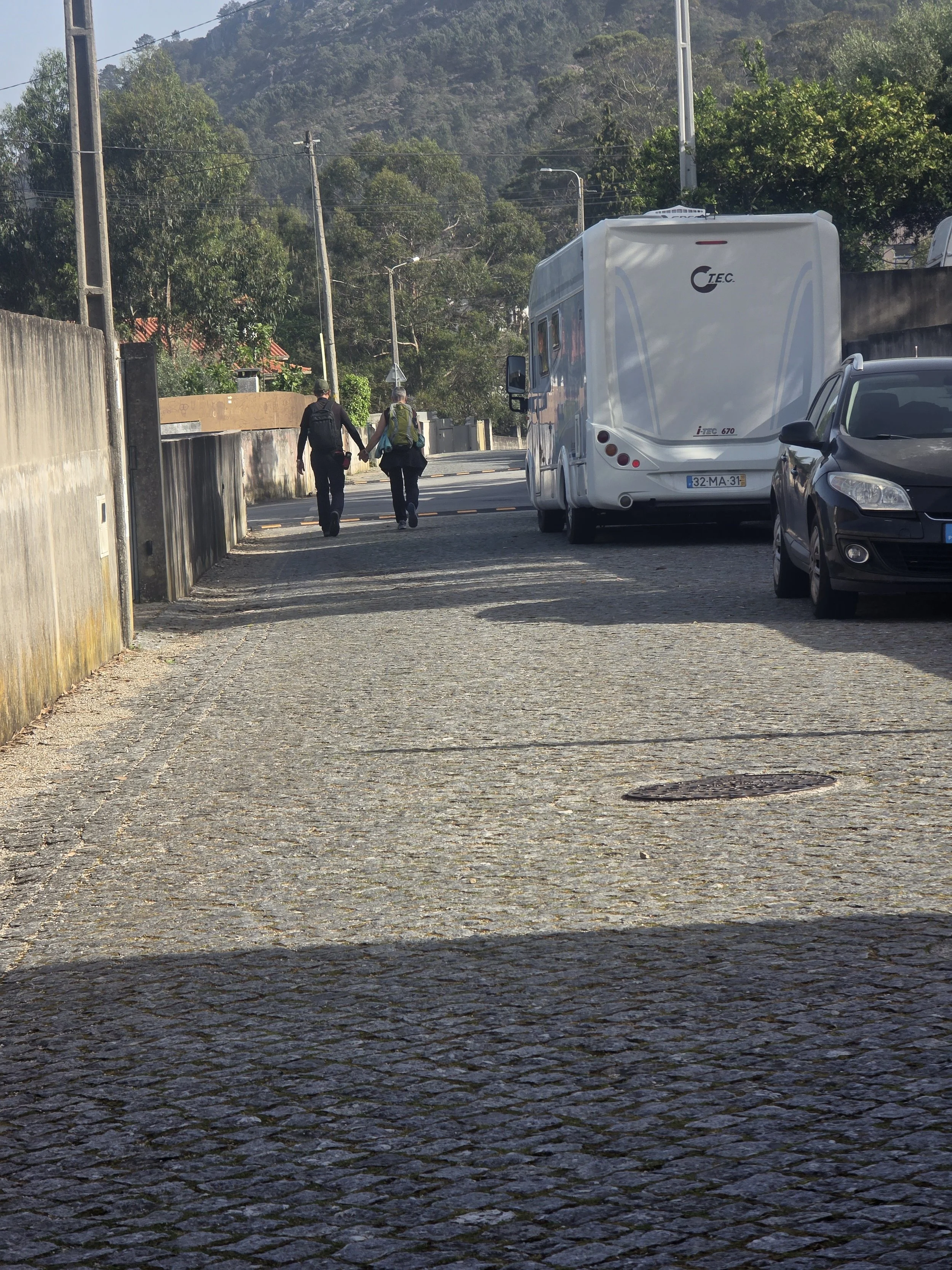 Cobblestones, cobblestones and more cobblestones. This pilgrim couple caught my attention.