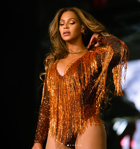 Here is Bey looking amazing in orange. I repeat, orange.