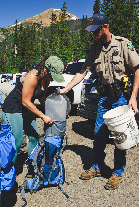 Fish Being Placed in Backpack.jpg