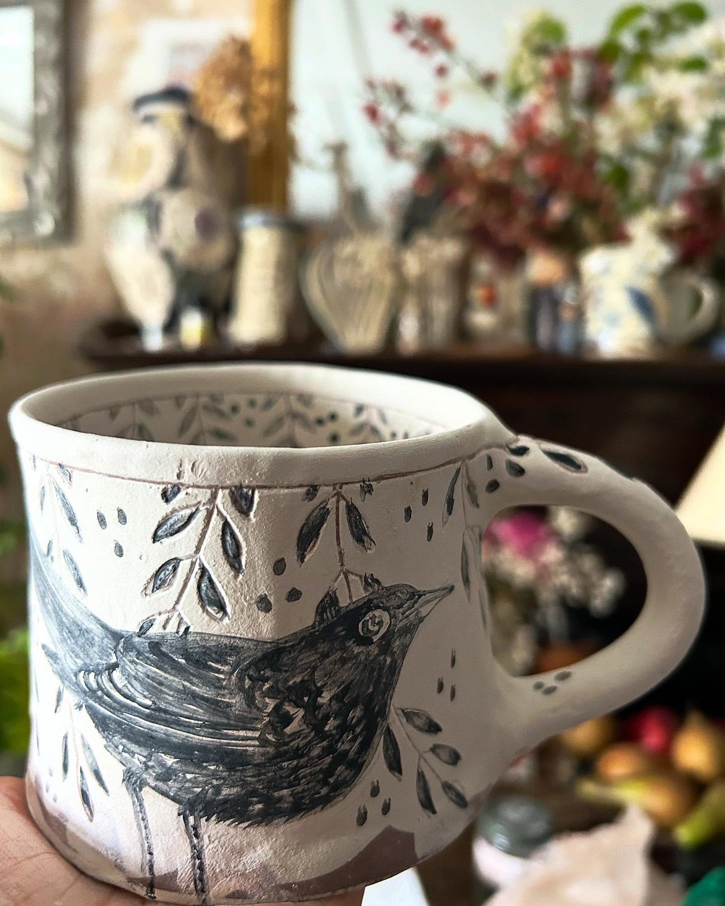 Blackbird (that will actually be blue after firing) …#mug #mugshotmonday #slipware #slipwarepottery #wip #handmade #handpainted #sgraffito #inspiredbynature #inspiredbybirds