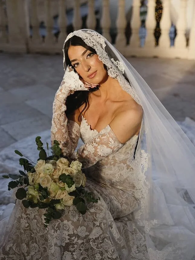 Elizabeth looked breathtaking in this all lace @eveofmilady wedding gown at her Florida wedding! She styled it beautifully with matching overskirt, sleeves, and an amazing mantilla style veil. 
Congratulations to the beautiful couple!! 
&bull;
Photos