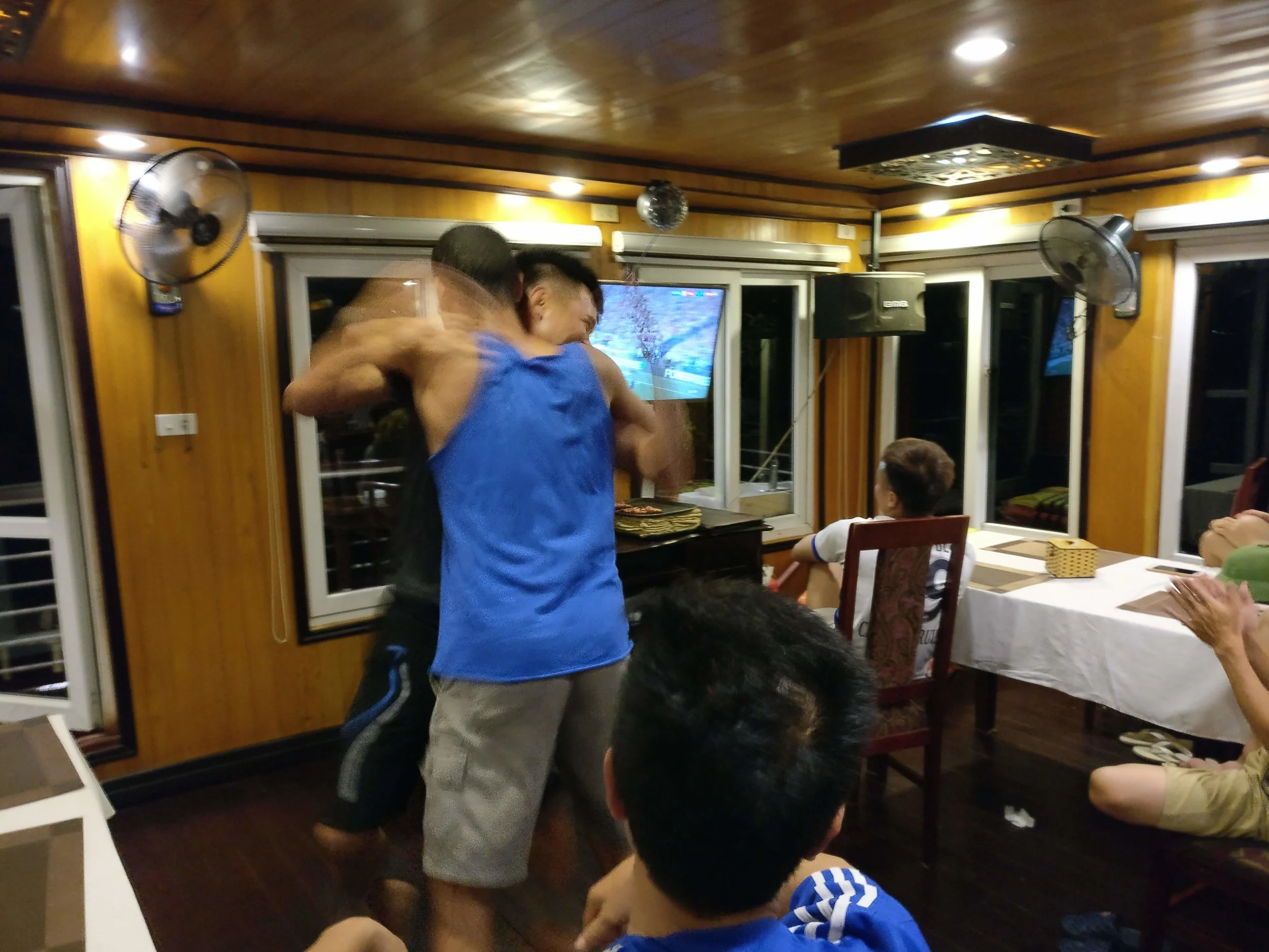 Andre and a crew member celebrating France's 4th goal 