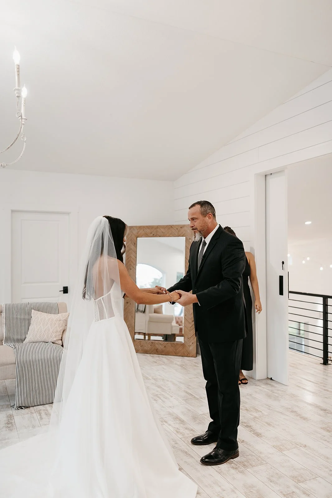 first look with a bride and her dad in the barn at grace hill bridal suite