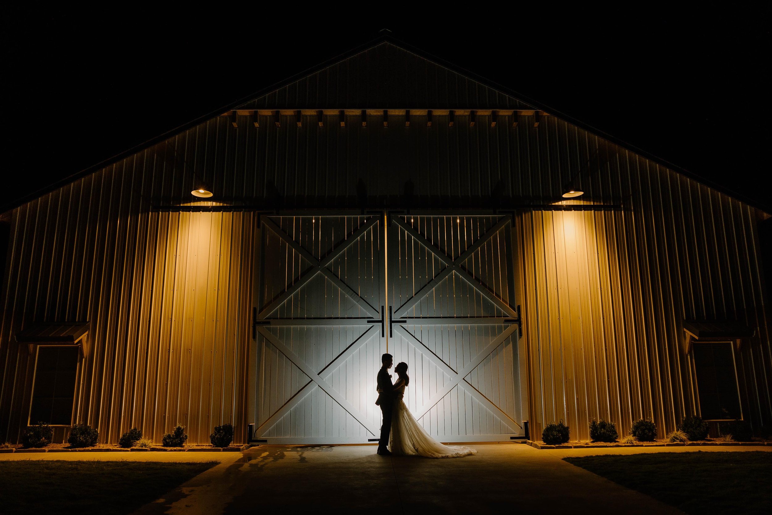 couple-nighttime-exterior-white-barn.jpg