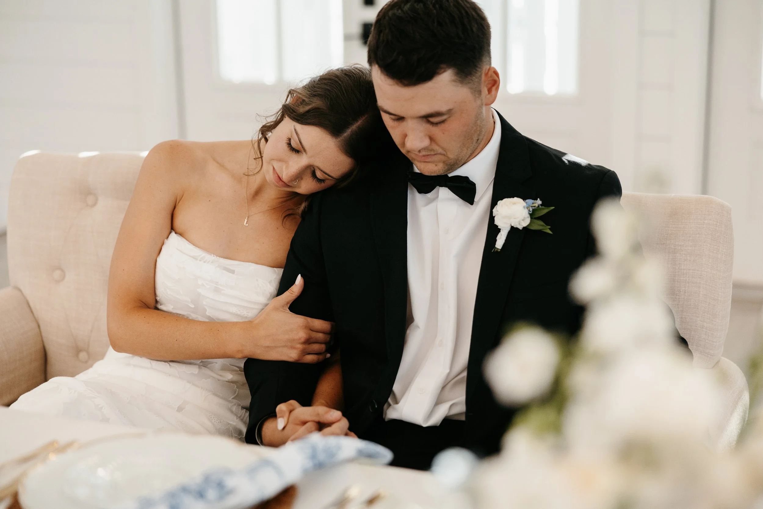 bride and groom during prayer before their reception at The Barn at Grace Hill