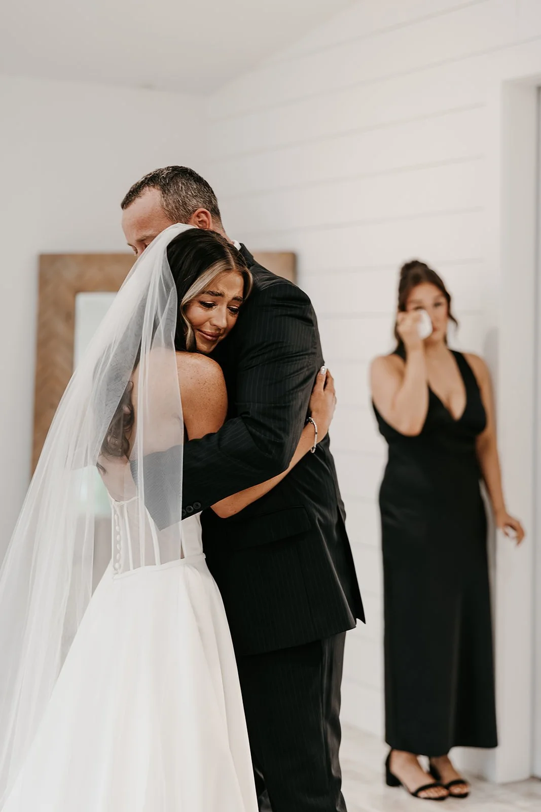 emotional bride hugging her dad in the barn at grace hill bridal suite