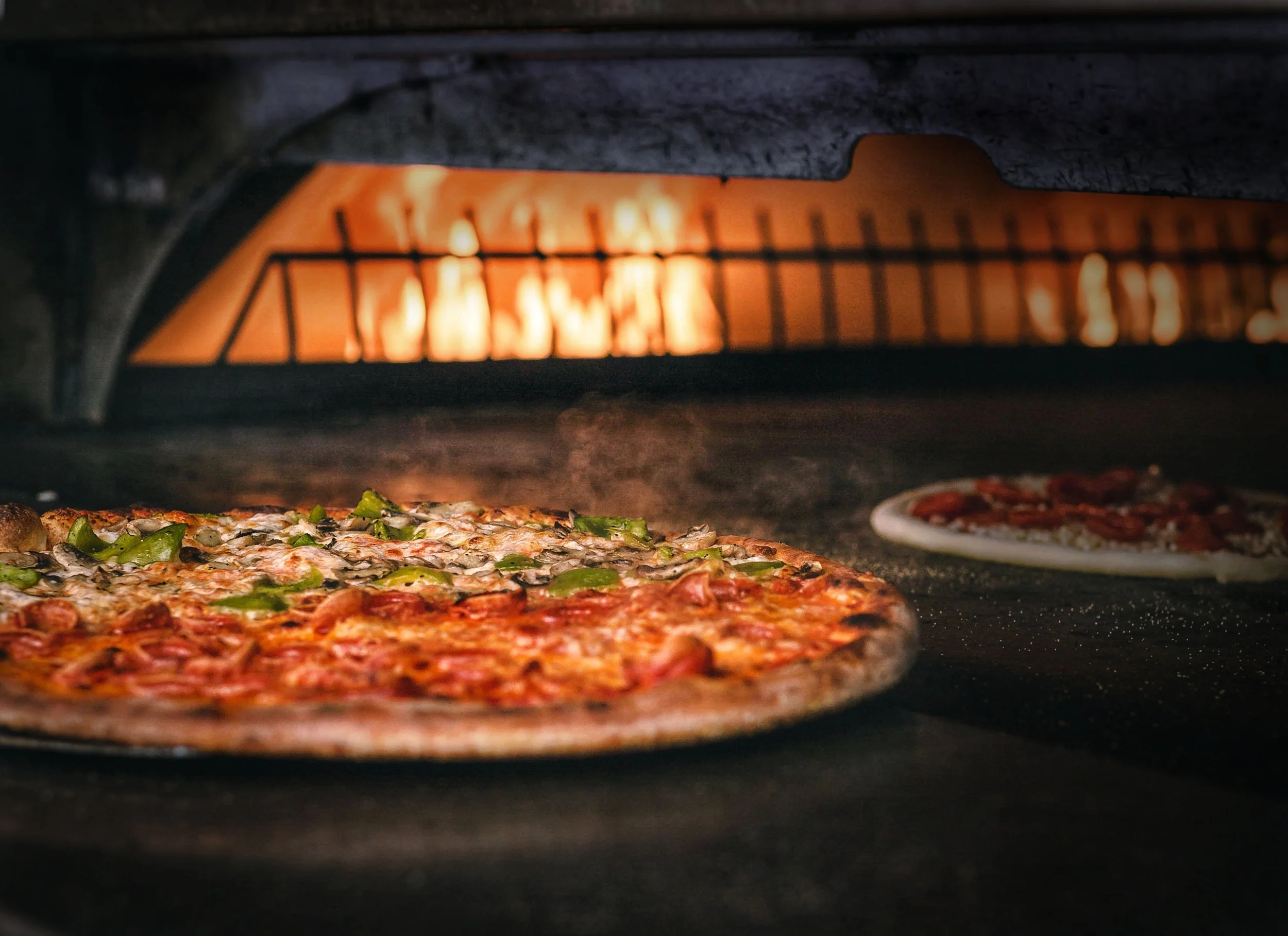 half and half pizza in oven (vignetted).jpg