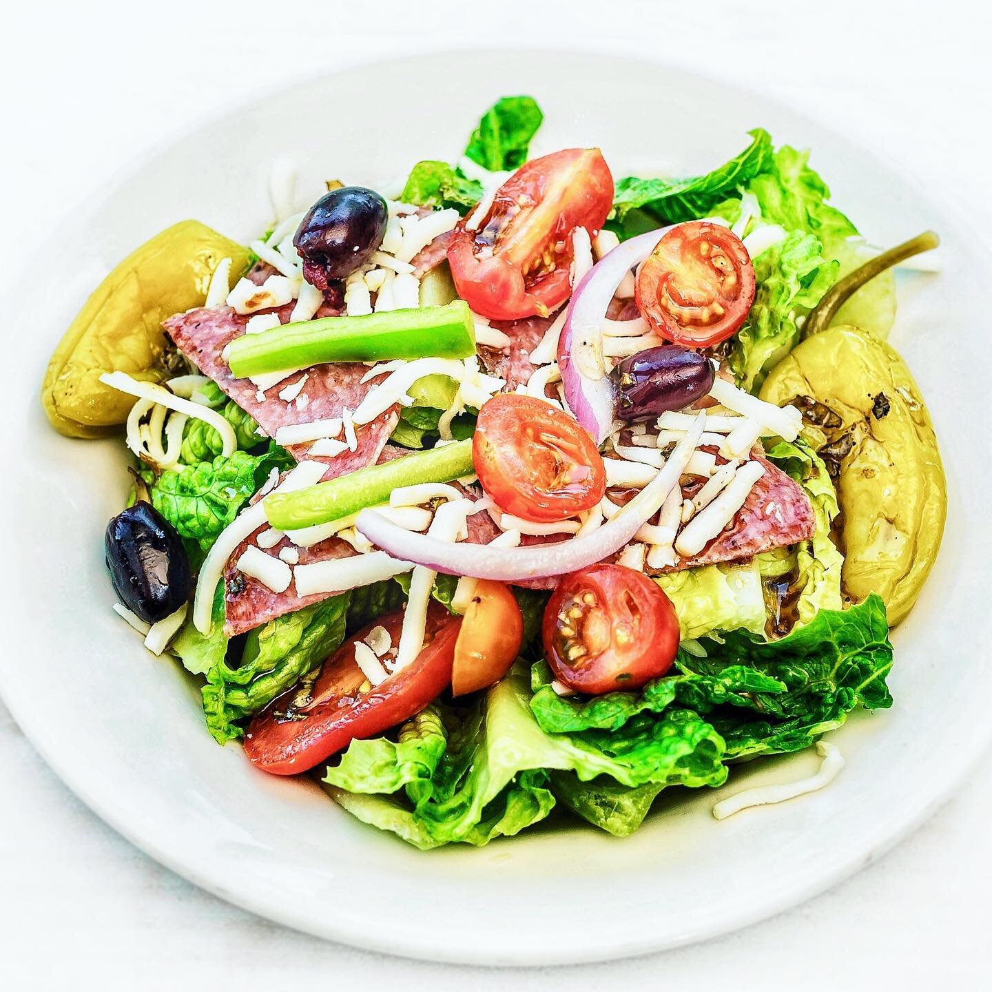 Our ANTIPASTO SALAD is the perfect starter with Italian salami, pepperoncini, whole kalamata olives, mozzarella, tomato, red onion &amp; green pepper, over crisp romaine 🥗 

Join us or order online! Link in bio.