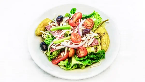 Amici’s Antipasto Salad with Italian salami, pepperoncini, whole kalamata olives, and mozzarella.