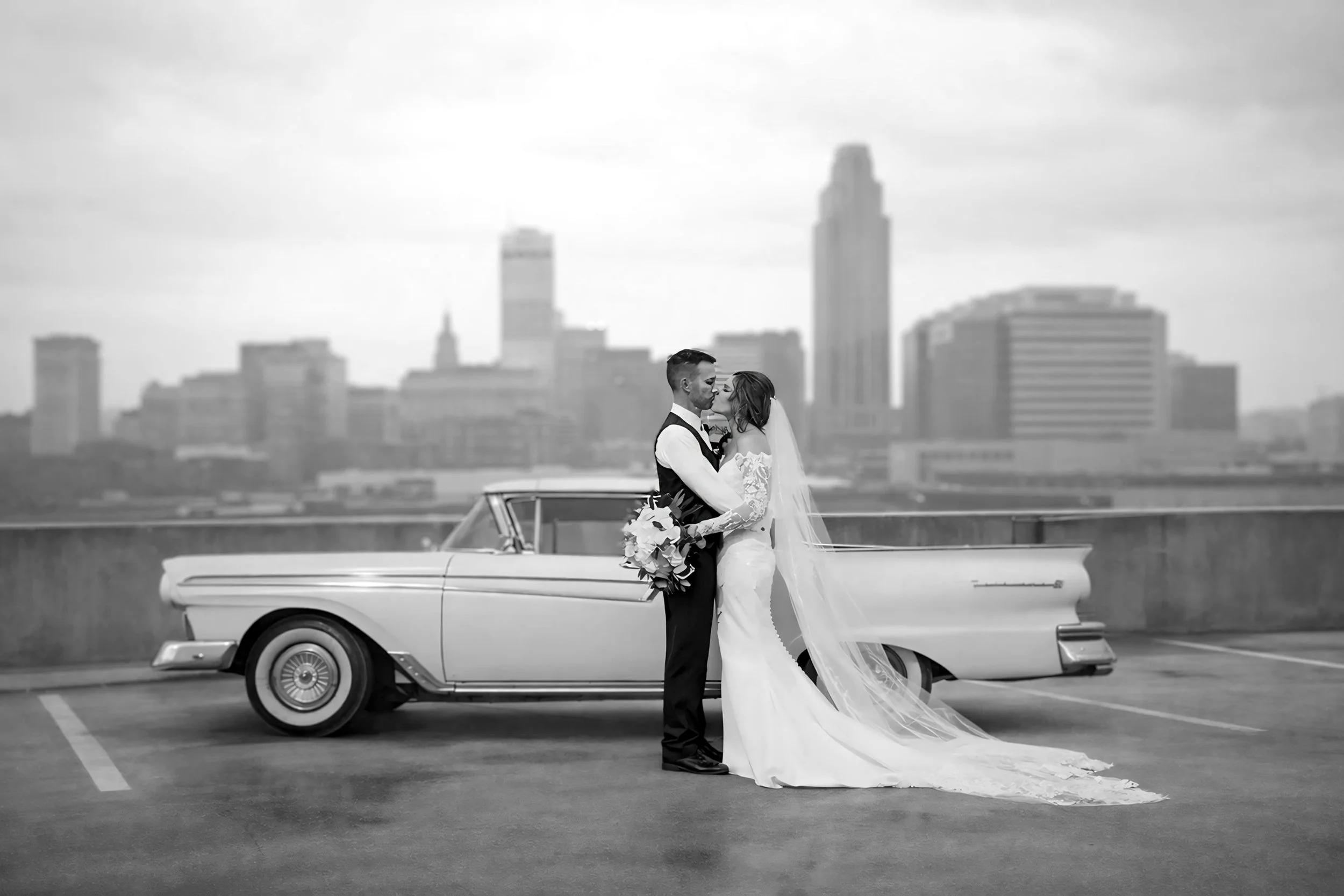 Omaha Wedding Photographer | Bride and Groom with Downtown Skyline