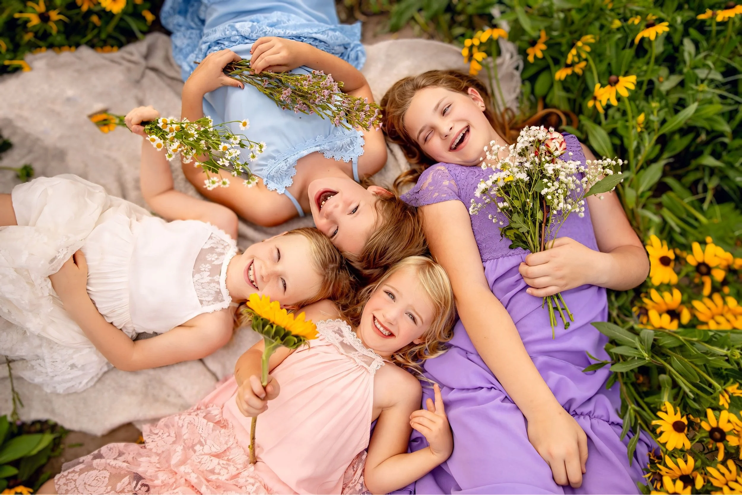 Omaha Family Photographer – Fun Candid Family Session in flower field with Kids