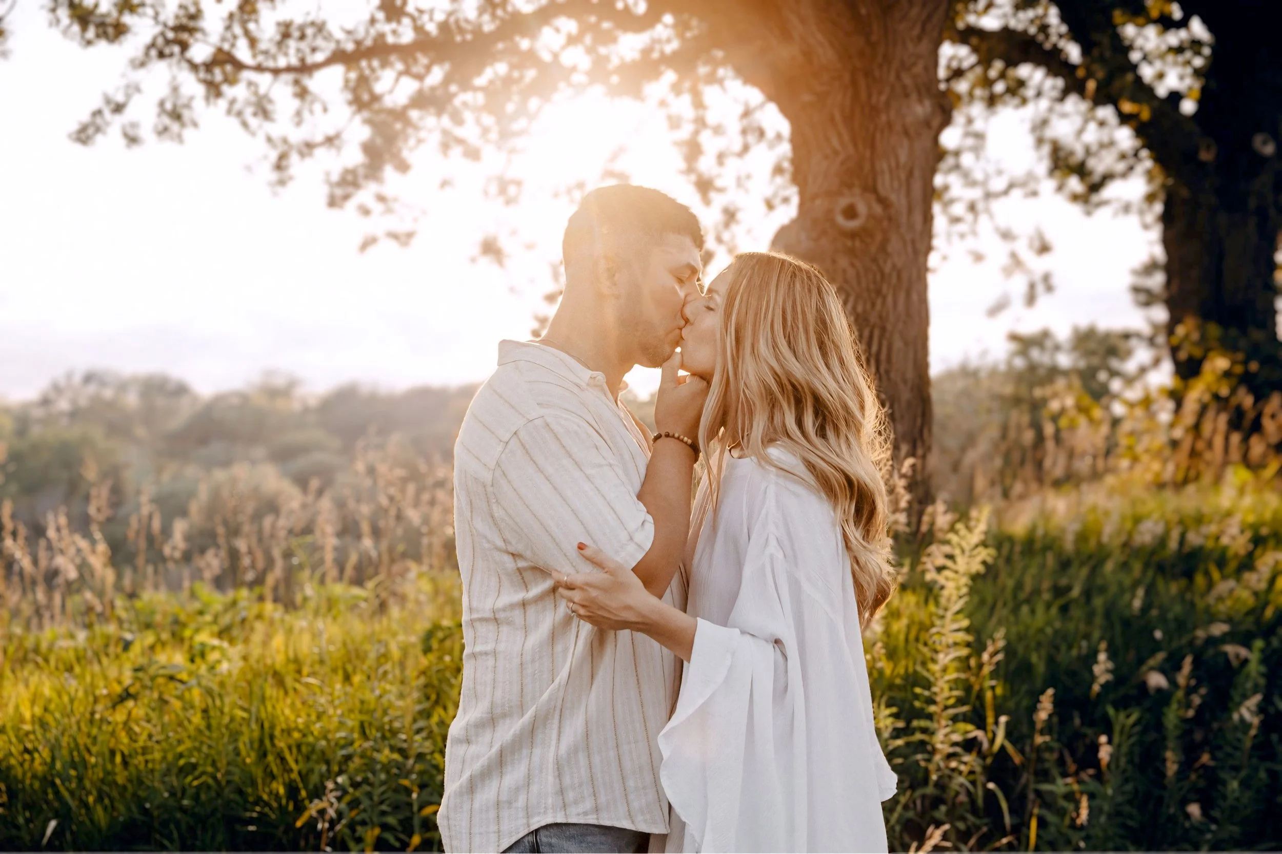 Omaha Engagement Photographer | Kissing at Sunset | Neale Woods 